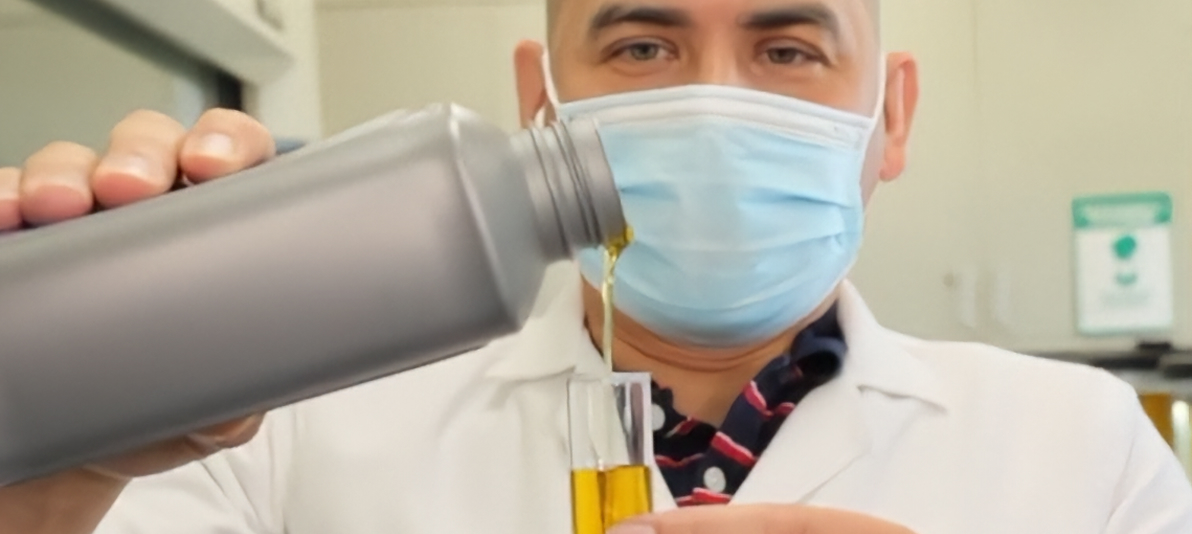 Laboratory technician testing a lubricant sample